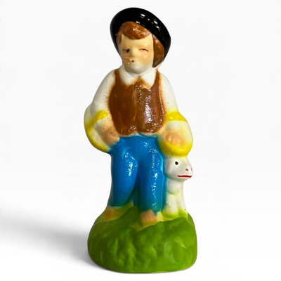 Figura com cestas e cão