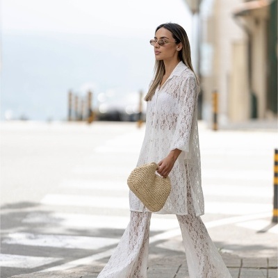 CALÇAS FLARE EM MALHA RENDADA SAHOCO