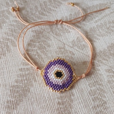 Pulseira olho protetor