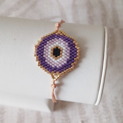 Pulseira olho protetor