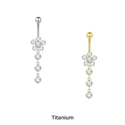 Joia de Titânio para umbigo com flor de zirconias e pendente de 3 zirconias redondas TN057