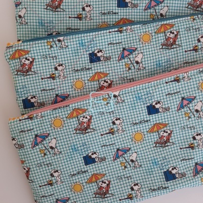 Bolsinhas multiusos padrão Snoopy na praia