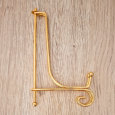 Suporte para gráfico em metal dourado