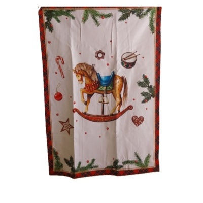 Pano de cozinha com cavalo de baloiço e outros motivos de Natal.