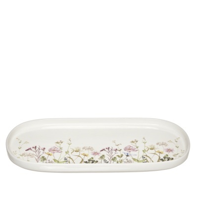 Torteira em porcelana decorada com flores.