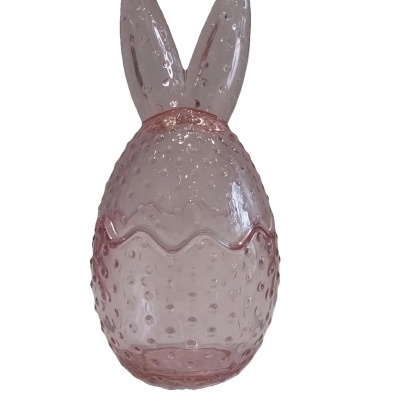 Bomboneira  em vidro cor de rosa com orelhas de coelho.