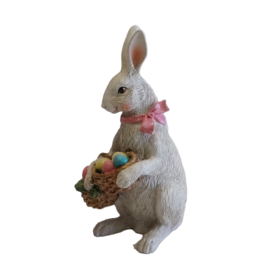 Coelha com laço e cesta com ovos de Páscoa.