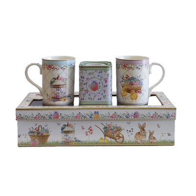 Conjunto de 2 canecas em porcelana e uma lata para chá.